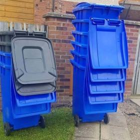 blue wheelie bins outside house