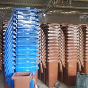 Black blue and brown wheelie bins