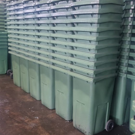 Stacks of green bins