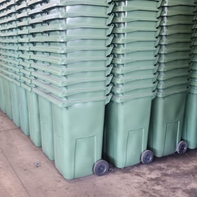 Stacks of green bins